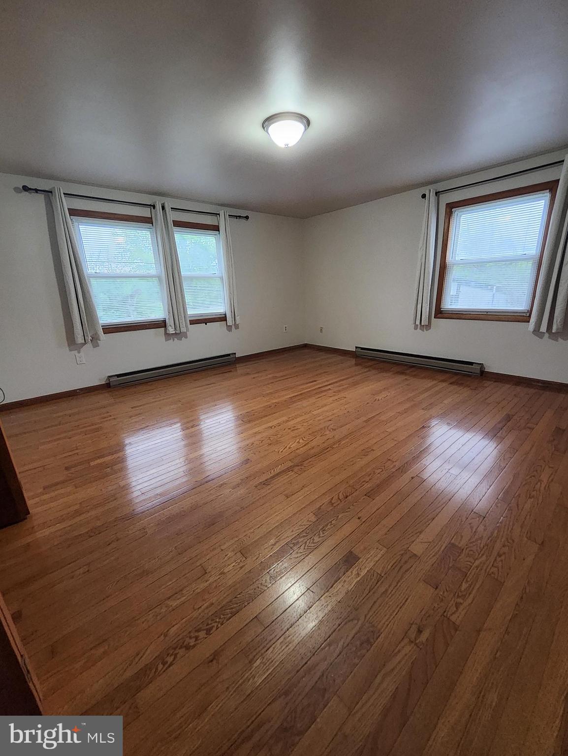 415 View Town Road Amissville, VA 20106 - Photo 8 of 19 wooden floor in an empty room with a window