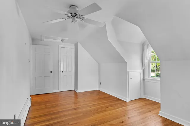 an empty room with a bathroom and a en suite bathroom