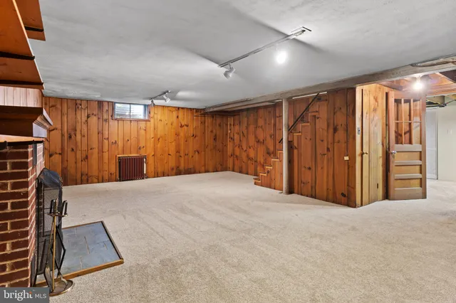 an empty room with furniture and window