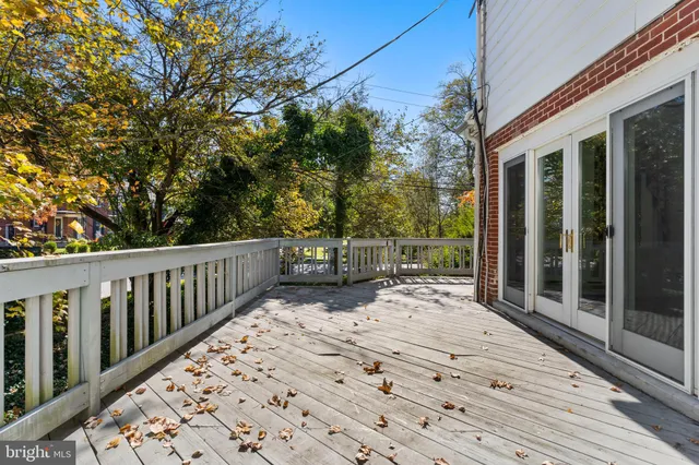 a balcony with trees in front of it
