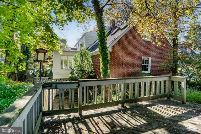 a view of a house with pool and sitting area