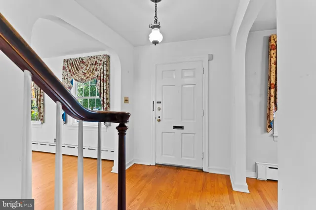 a view of a room with wooden floor and stairs