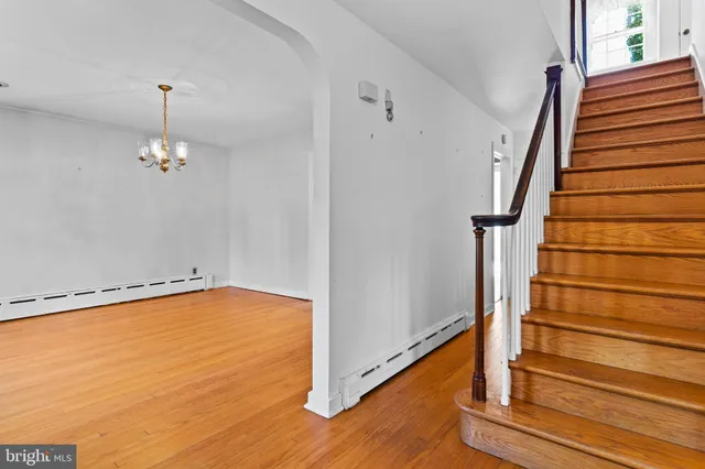 a view of an entryway with wooden floor