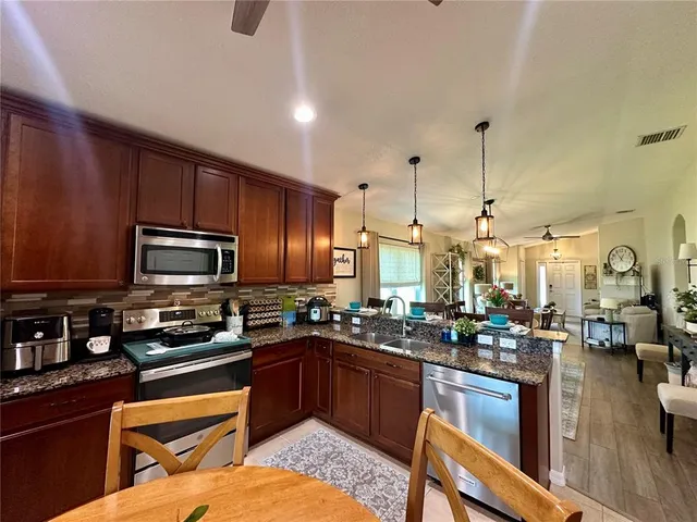 a room with a bed and a chandelier