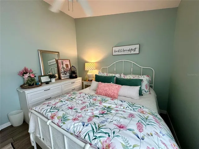 a living room with furniture a window and a table