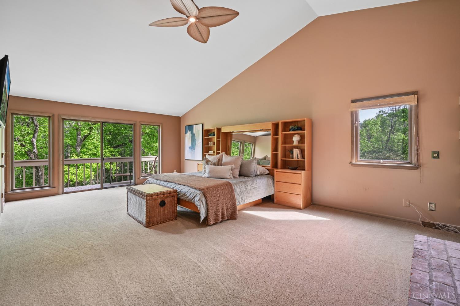 559 Asbury Road Cincinnati, OH 45255 - Photo 22 of 50 Spacious primary retreat: Private deck, skylight, walk-in closet, gas fireplace