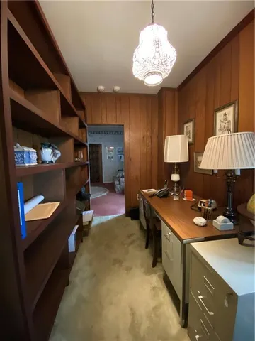 a open kitchen with stainless steel appliances granite countertop a stove and a refrigerator