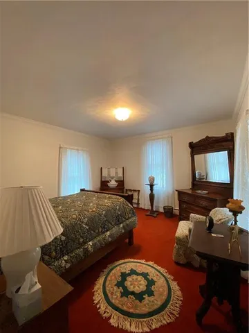 a living room with furniture and a lamp