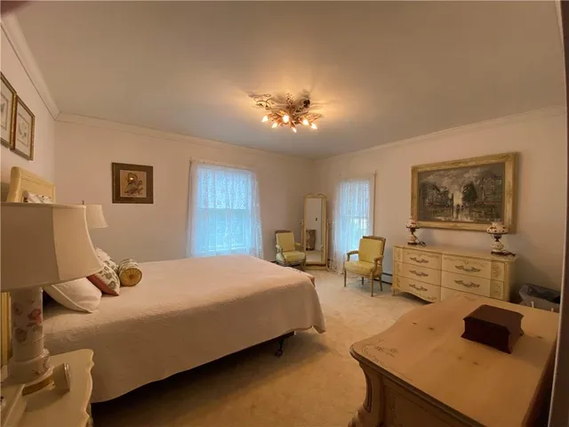 a bedroom with a bed and furniture