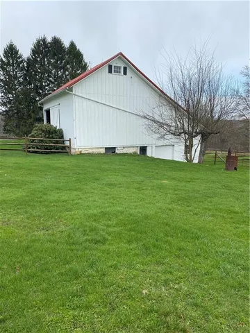a view of a backyard of the house