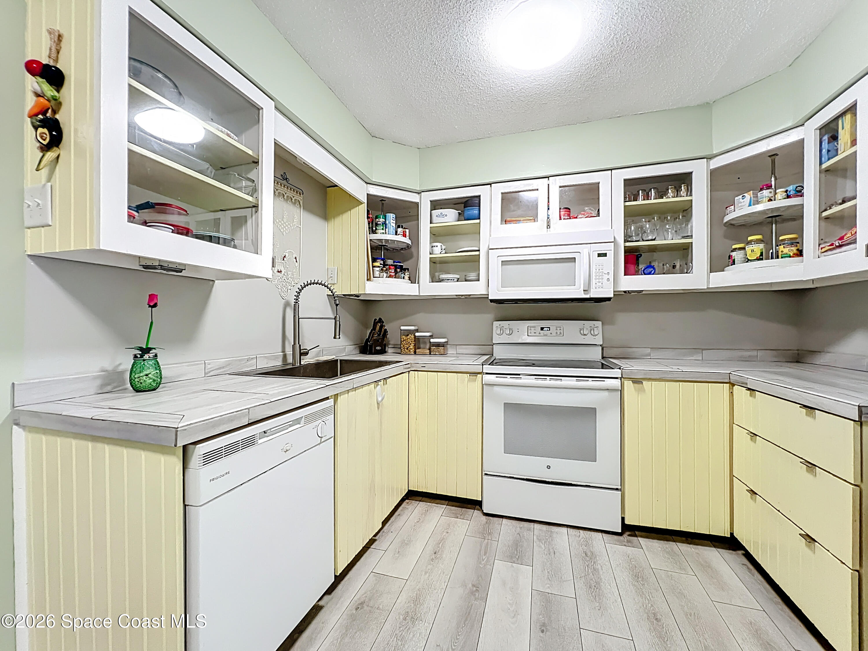 854 Angle Street Northeast Palm Bay, FL 32905 - Photo 11 of 23 a kitchen with stainless steel appliances granite countertop a stove and a sink