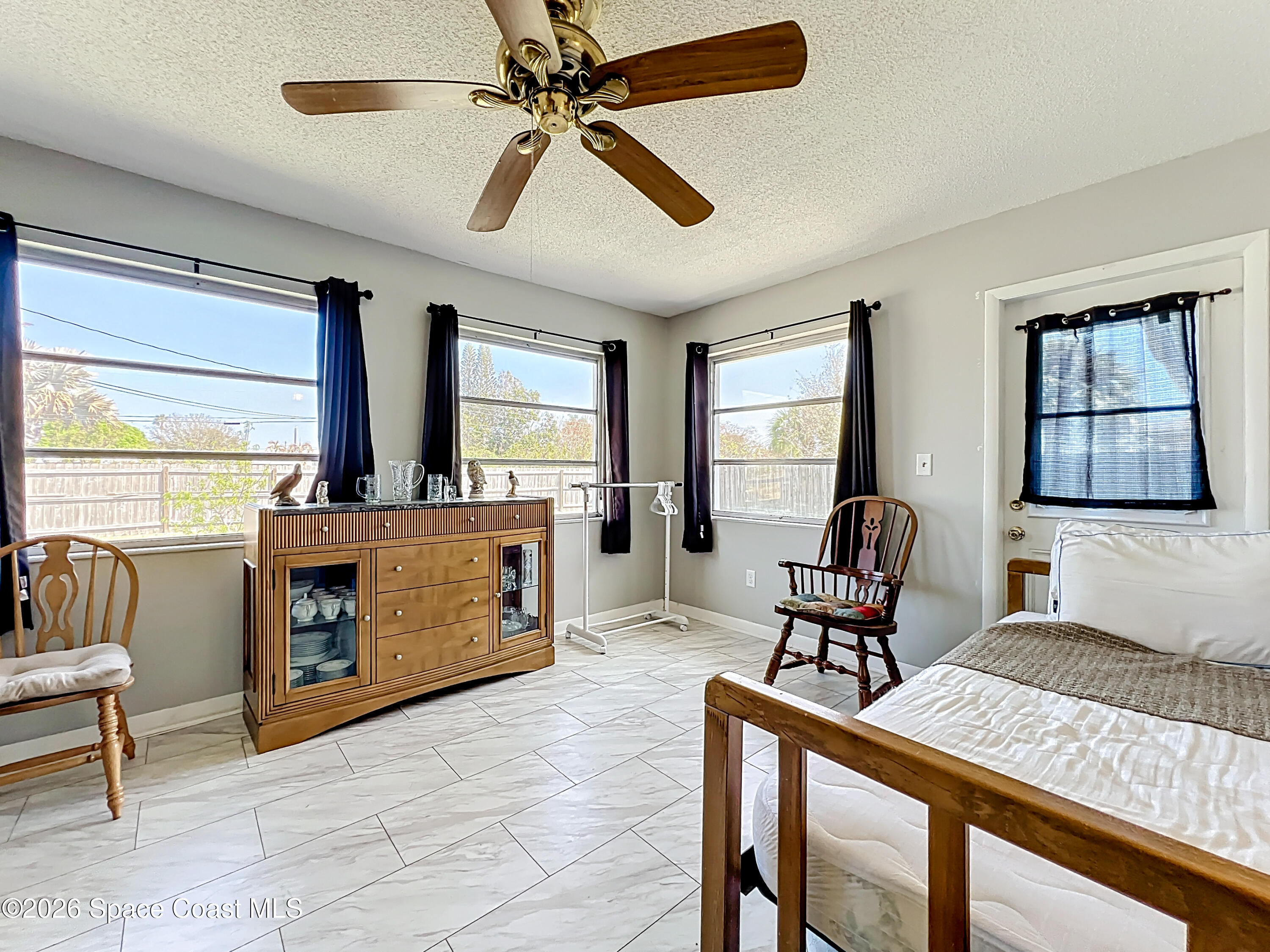 854 Angle Street Northeast Palm Bay, FL 32905 - Photo 16 of 23 a living room with furniture and a flat screen tv