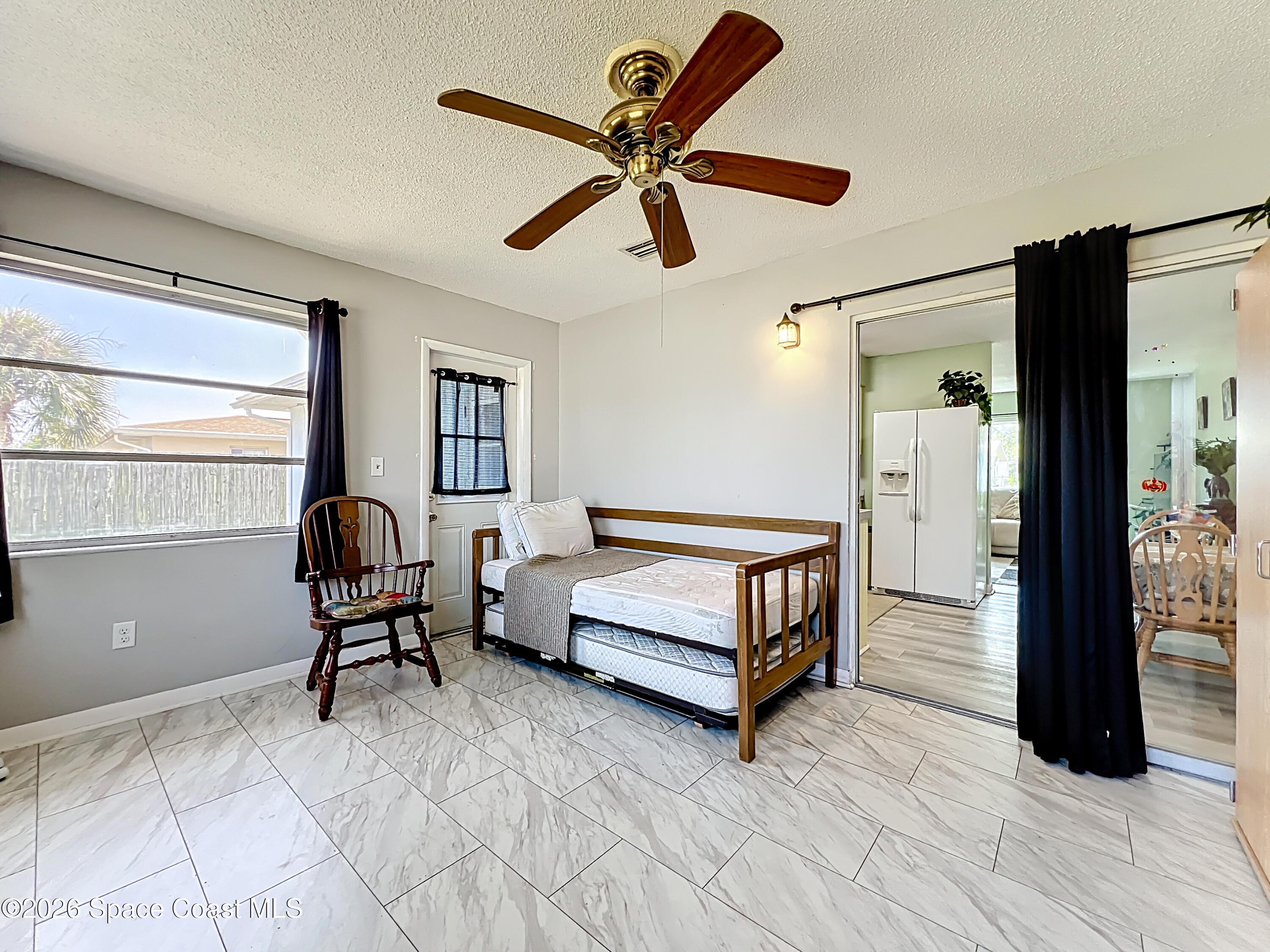 854 Angle Street Northeast Palm Bay, FL 32905 - Photo 17 of 23 a bedroom with furniture and window