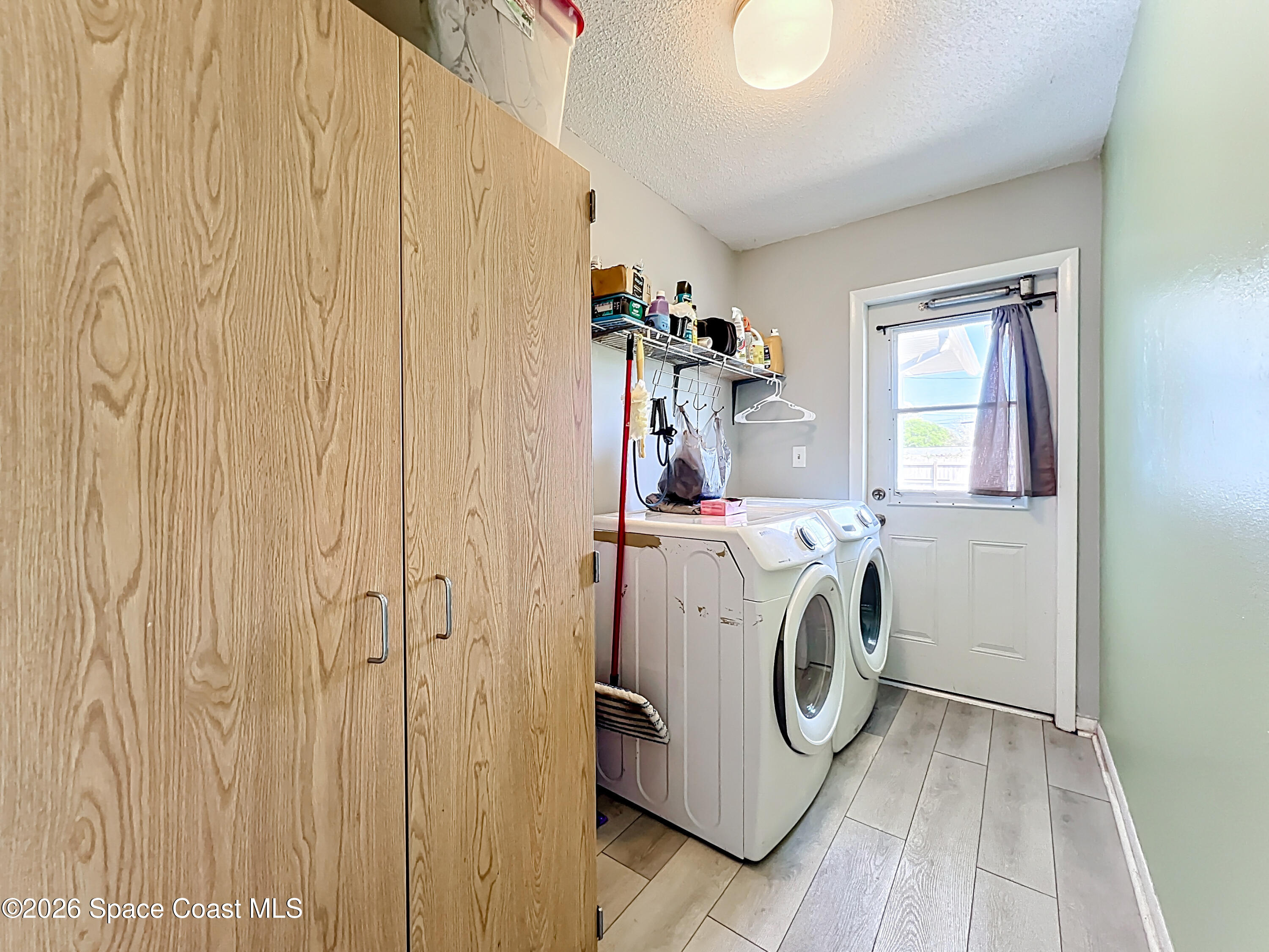 854 Angle Street Northeast Palm Bay, FL 32905 - Photo 18 of 23 a utility room with dryer and washer