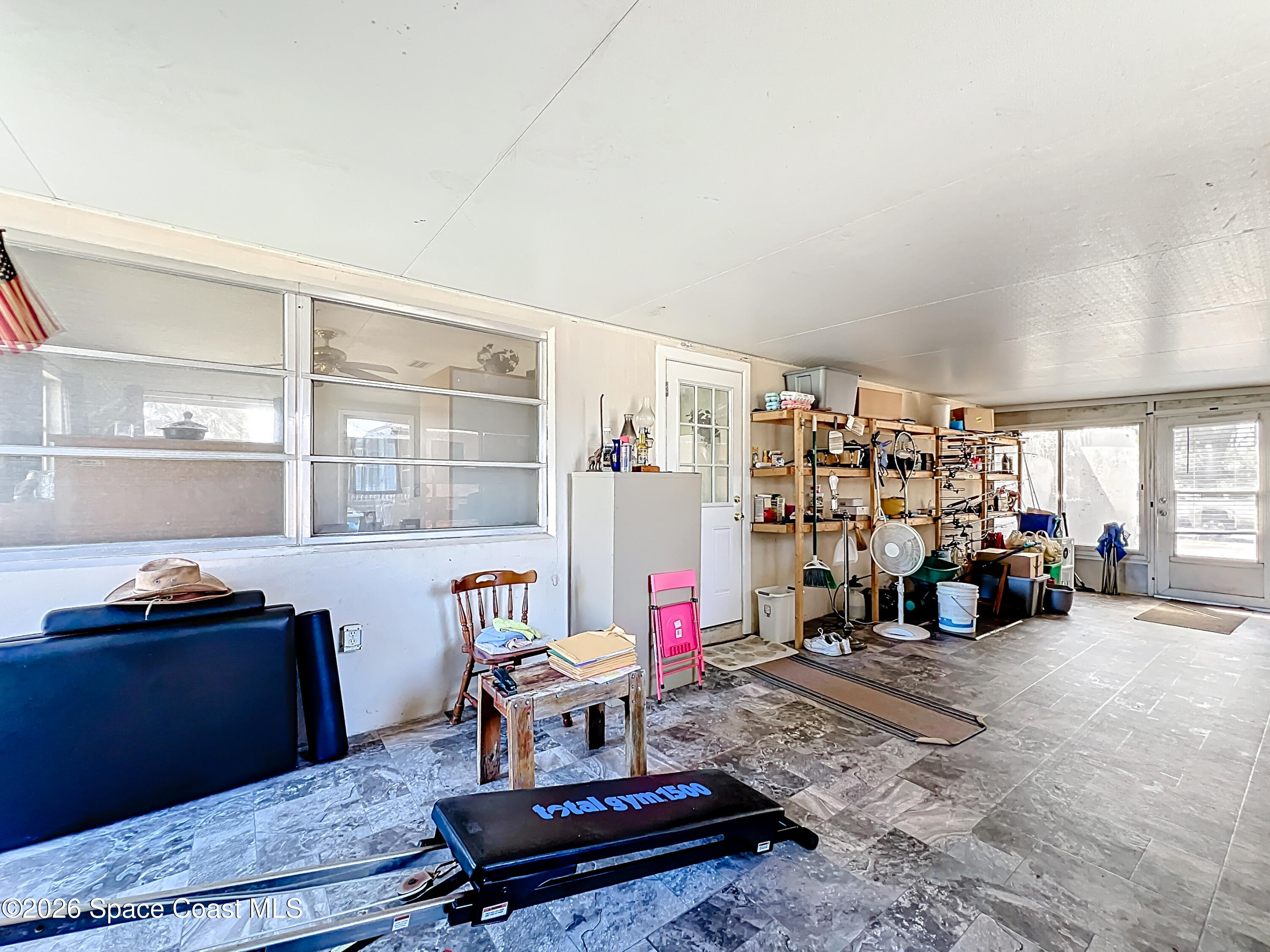 854 Angle Street Northeast Palm Bay, FL 32905 - Photo 20 of 23 a living room with furniture a air conditioner and a window