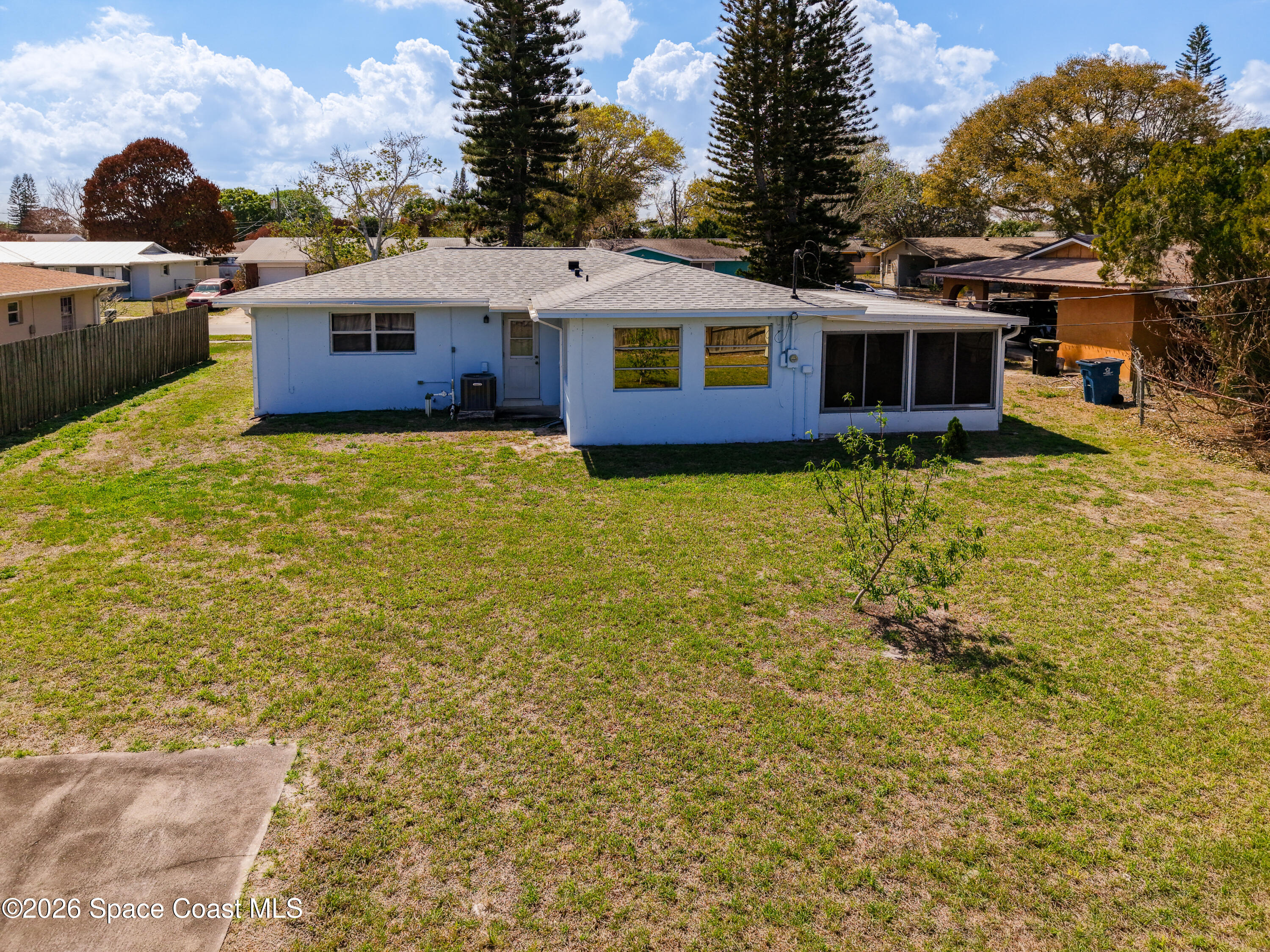 854 Angle Street Northeast Palm Bay, FL 32905 - Photo 21 of 23 a front view of a house with a yard
