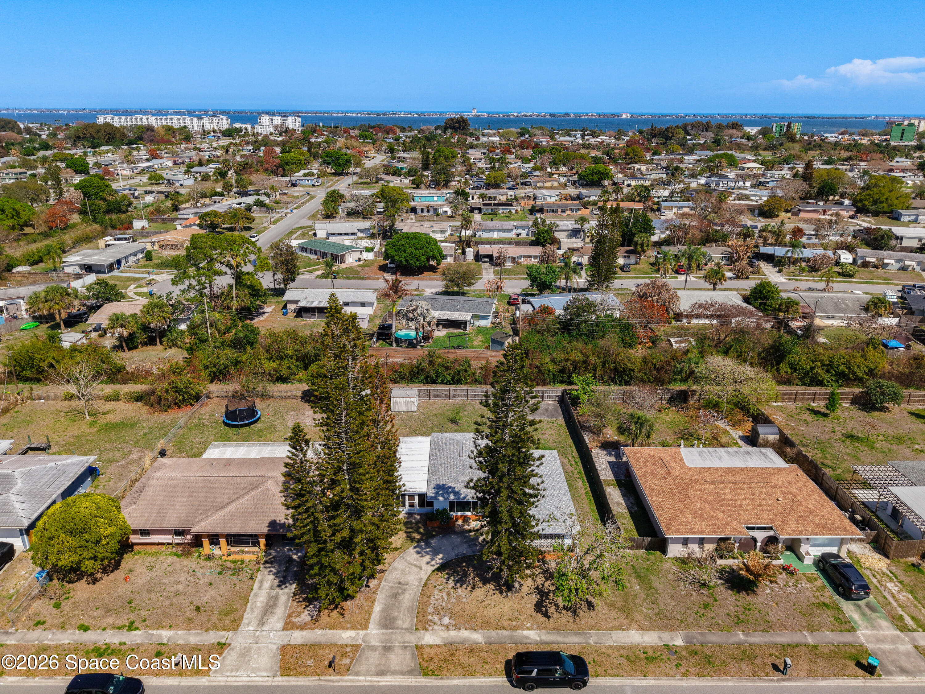 854 Angle Street Northeast Palm Bay, FL 32905 - Photo 4 of 23 an aerial view of residential houses with outdoor space