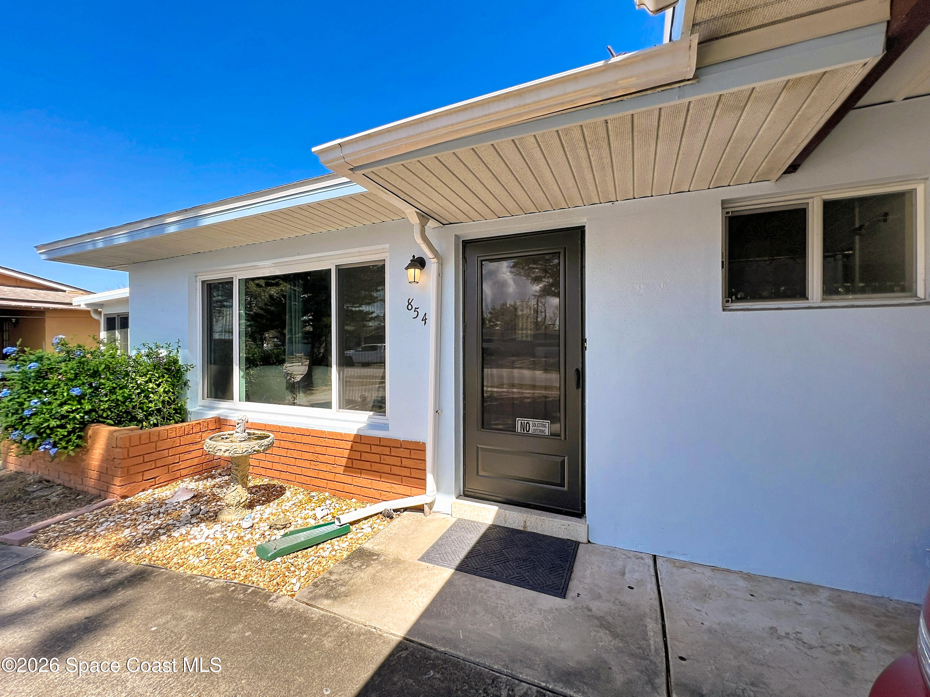 854 Angle Street Northeast Palm Bay, FL 32905 - Photo 5 of 23 a view of front door of house