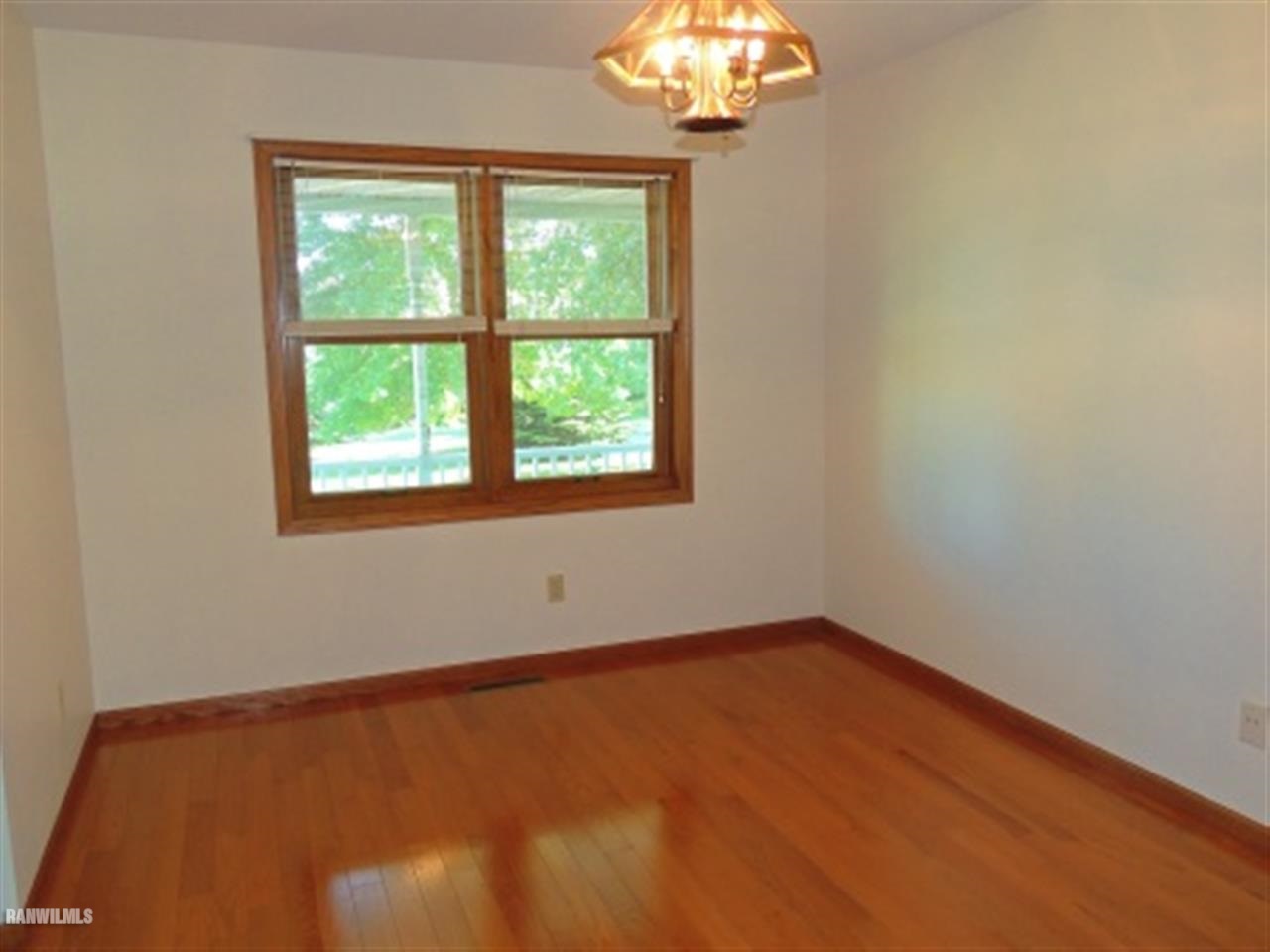10730 East Rock Grove Road Davis, IL 61019 - Photo 4 of 12 an empty room with a window