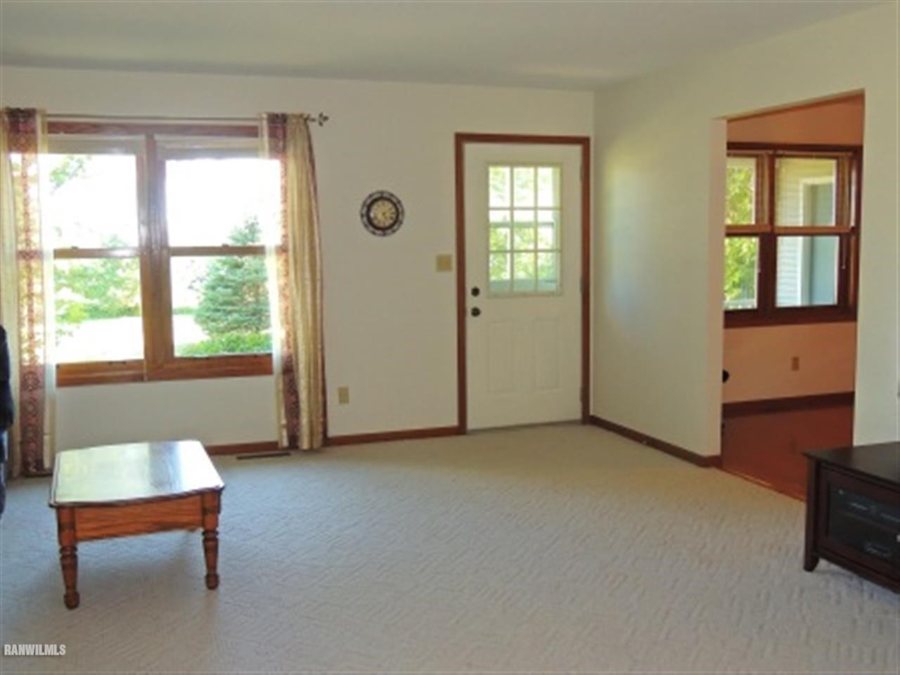 10730 East Rock Grove Road Davis, IL 61019 - Photo 7 of 12 a view of an empty room with a window and a livingroom