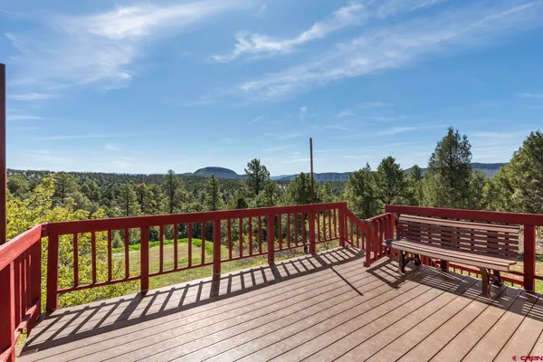 a view of wooden deck with a yard