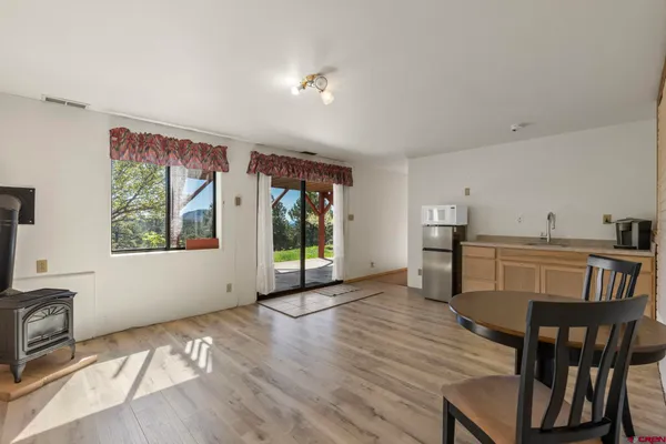 a view of a livingroom with furniture window and wooden floor
