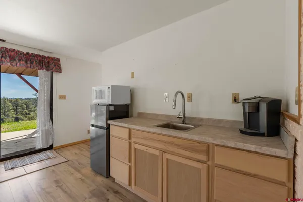 a kitchen with sink and window