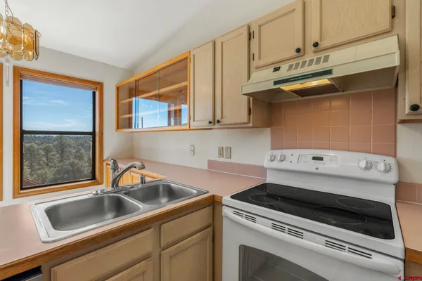 a kitchen with a stove and a sink