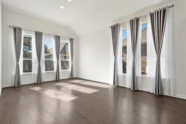 a bathroom with a sink a toilet a mirror a bathtub and shower