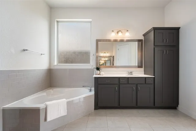 a view of a backyard with plants and a garden