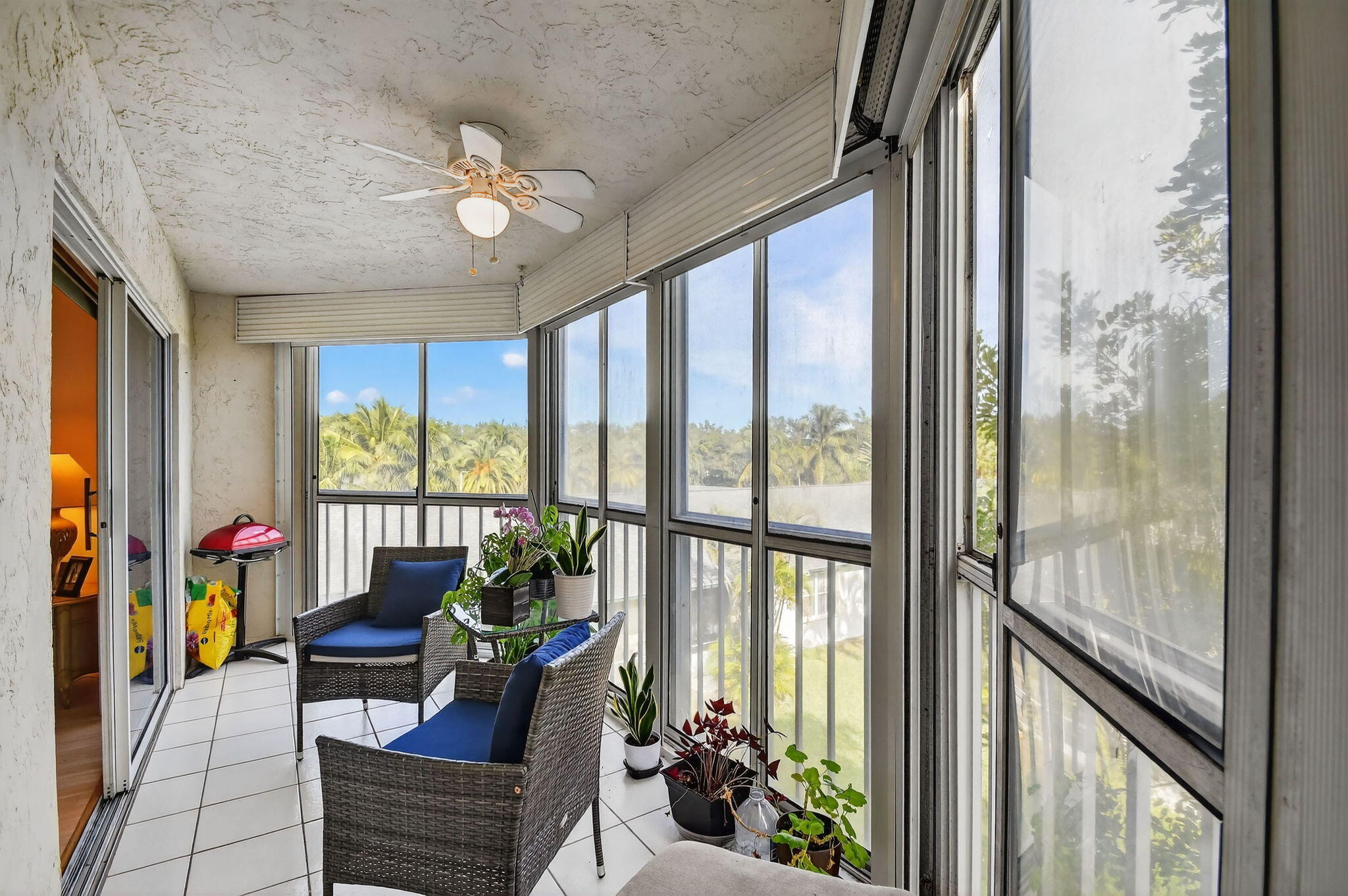 3146 Via Poinciana, Unit 301 Lake Worth, FL 33467 - Photo 14 of 23 a living room with furniture and a large window