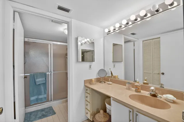 a bathroom with a sink double vanity and a mirror