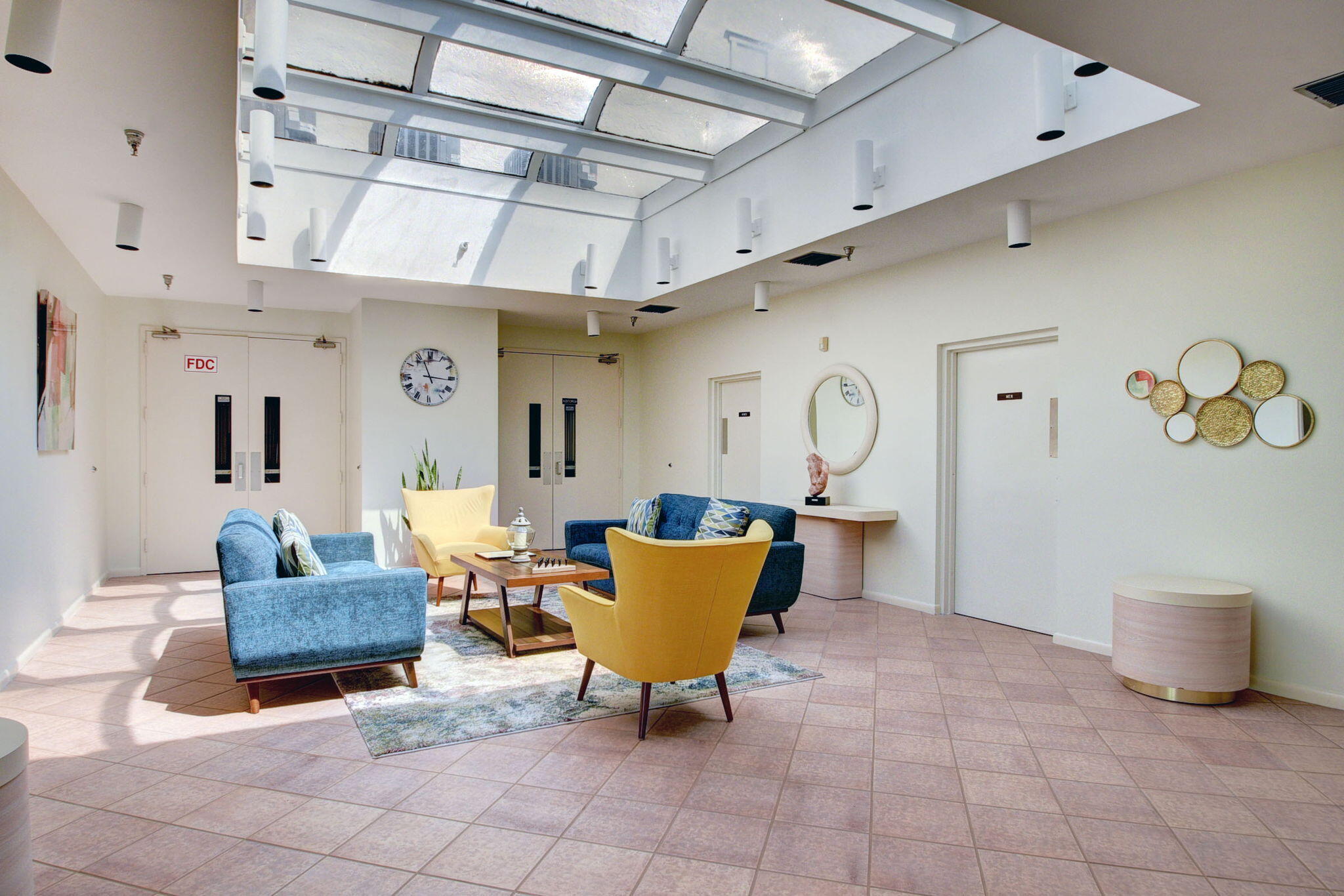 3146 Via Poinciana, Unit 301 Lake Worth, FL 33467 - Photo 22 of 23 a living room with furniture and a chandelier