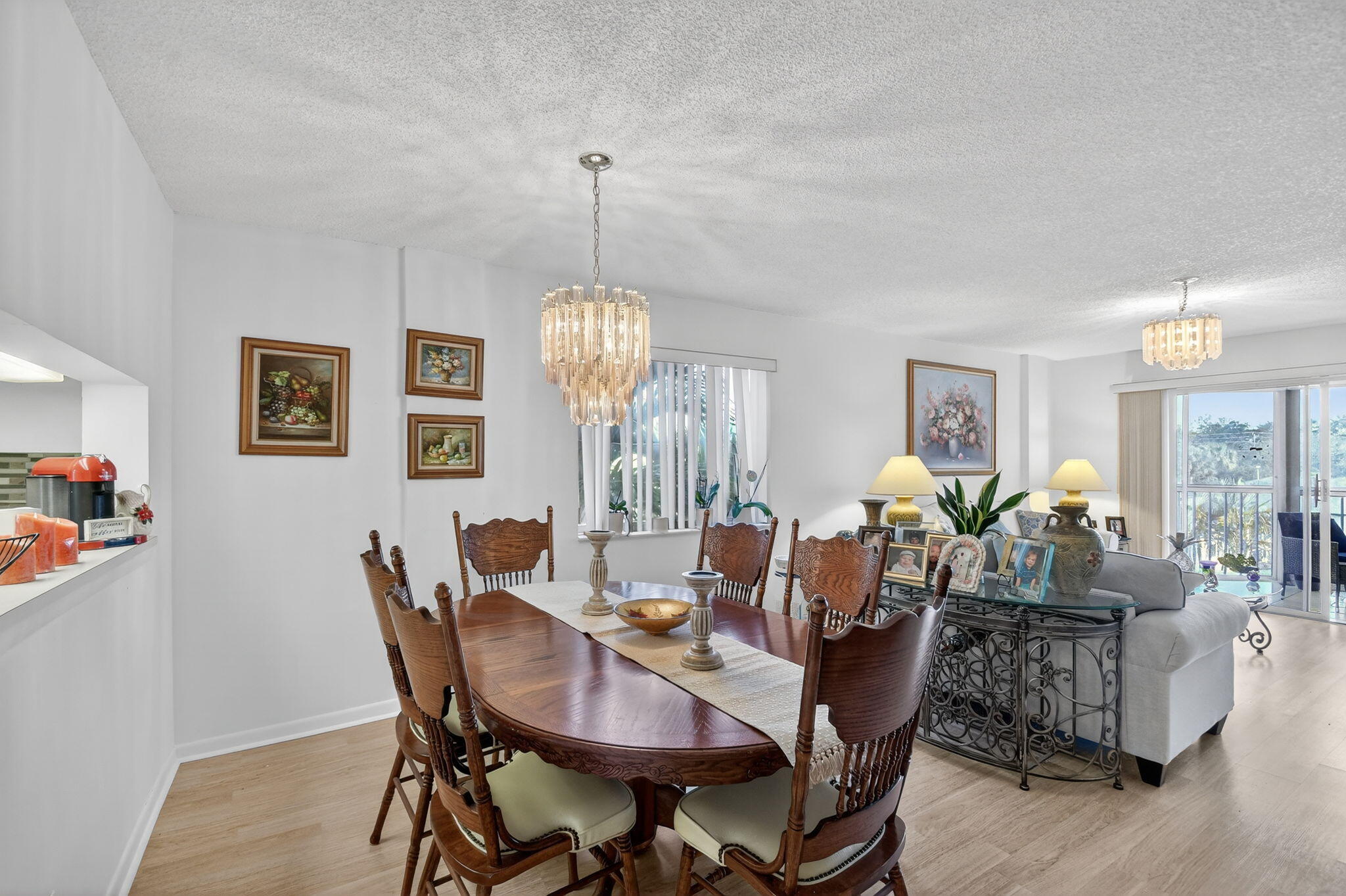 3146 Via Poinciana, Unit 301 Lake Worth, FL 33467 - Photo 8 of 23 a view of a dining room with furniture window and wooden floor