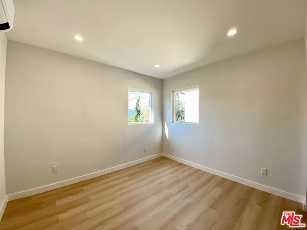 wooden floor in a room with a window
