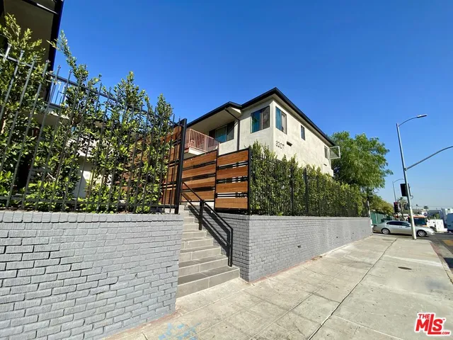 a view of a house with a small yard