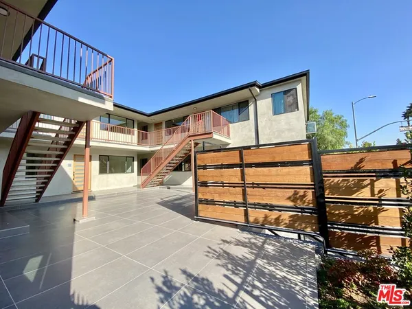 a view of a house with a street