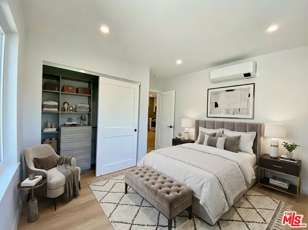 a bedroom with a bed and furniture