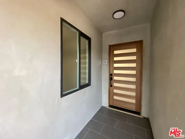 a view of a room that has a window in it