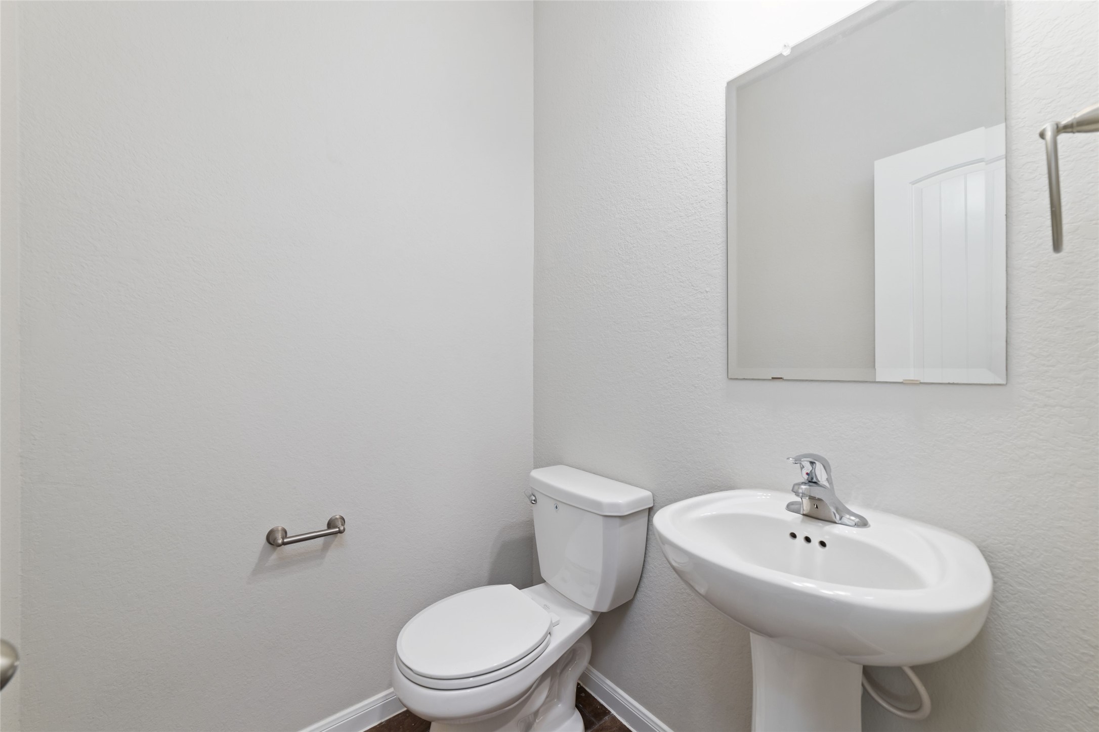 21622 Buttonsage Lane Katy, TX 77449 - Photo 9 of 17 a white toilet sitting next to a white sink