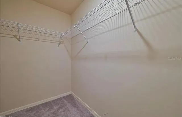 a view of a room with racks on the wall