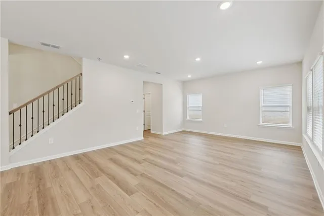 a view of kitchen with kitchen island and wooden floor