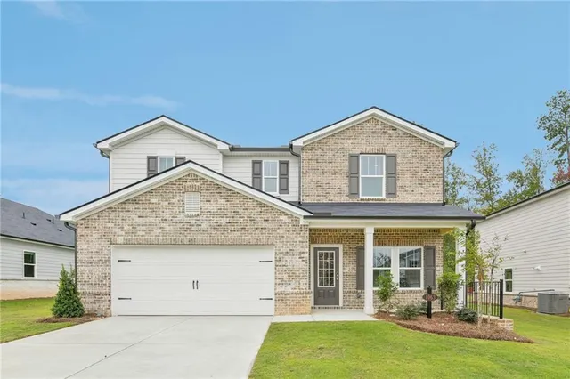 front view of a house with a yard