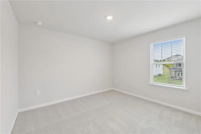 a bathroom with a granite countertop sink a toilet and bathtub