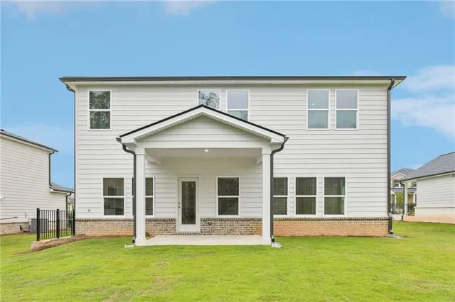 a picture of a bench in front of a house