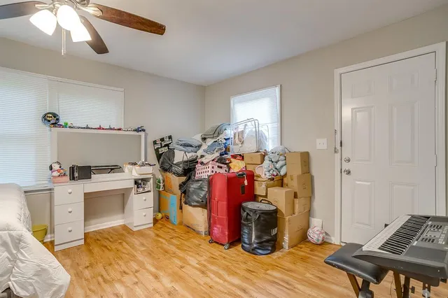 a view of a kitchen with fridge and workspace