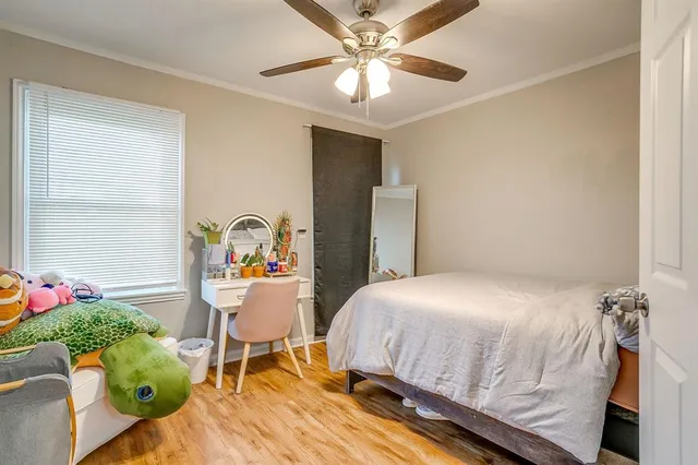 a bedroom with a bed and a chair