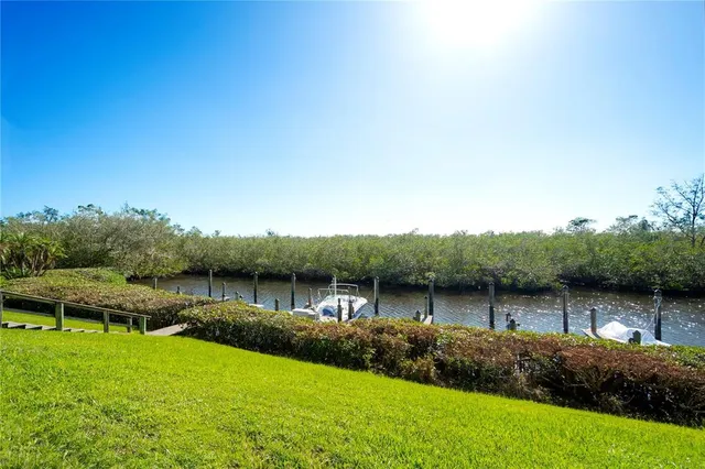 a view of a lake with houses in the back
