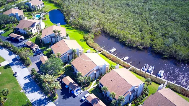 an aerial view of a house with a swimming pool yard and outdoor seating