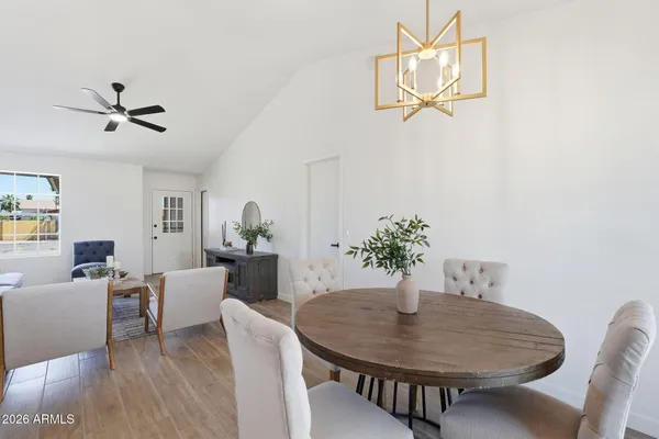 a dining room with furniture and window